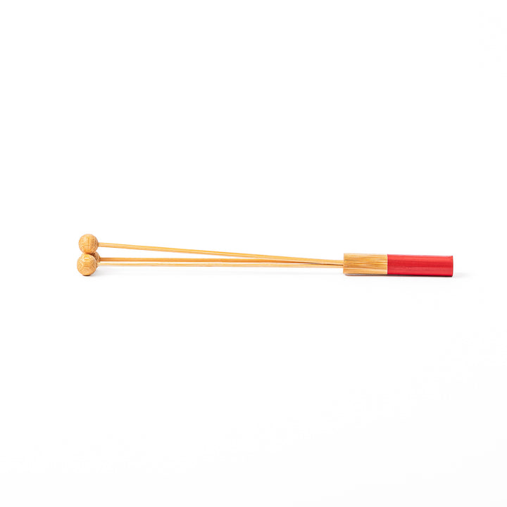 Single Japanese bamboo drink stirrer featuring a red handle top and wooden bead tips for mixing cocktails or tea