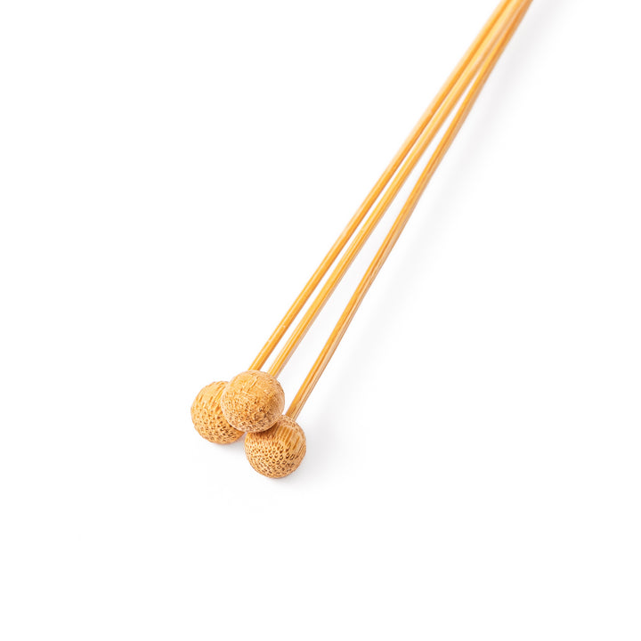 Single Japanese bamboo drink stirrer featuring a red handle top and wooden bead tips for mixing cocktails or tea