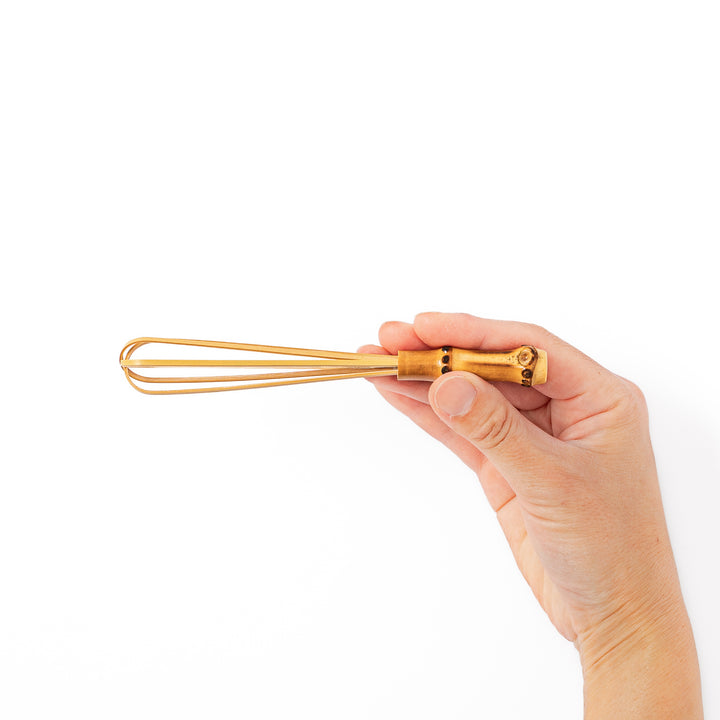 Japanese bamboo mini whisk with a natural root handle for whipping small portions of dressings or matcha