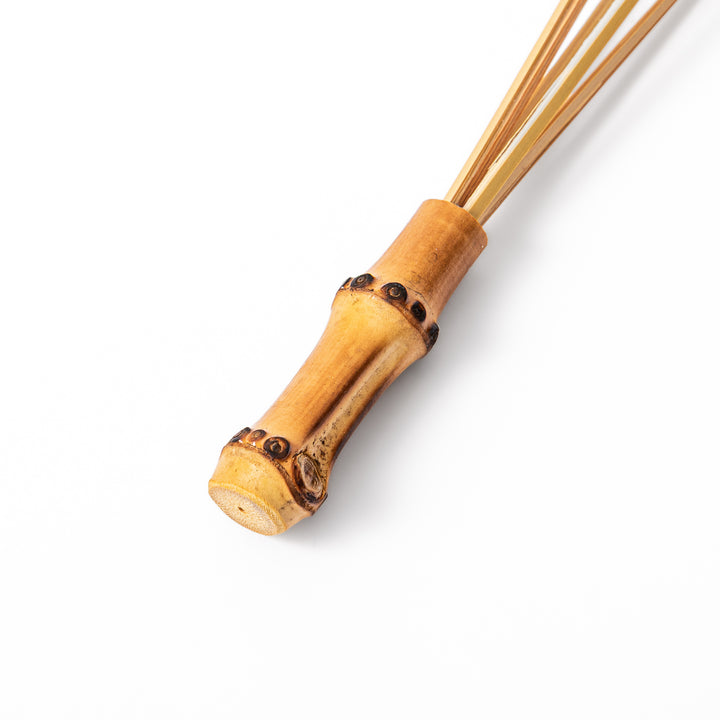 Japanese bamboo mini whisk with a natural root handle for whipping small portions of dressings or matcha