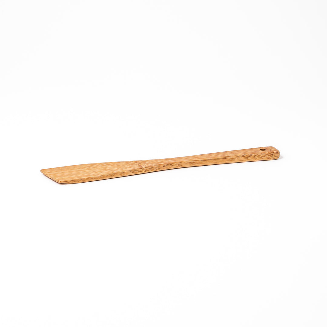 Handcrafted Japanese bamboo spatula for rice and pilaf featuring a natural bamboo finish and a convenient hanging hole