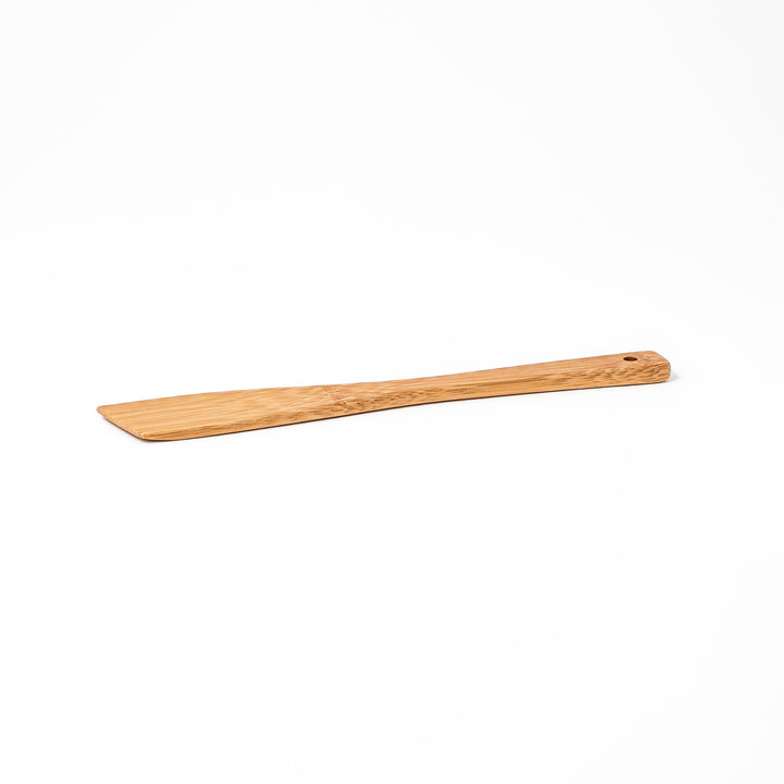 Handcrafted Japanese bamboo spatula for rice and pilaf featuring a natural bamboo finish and a convenient hanging hole