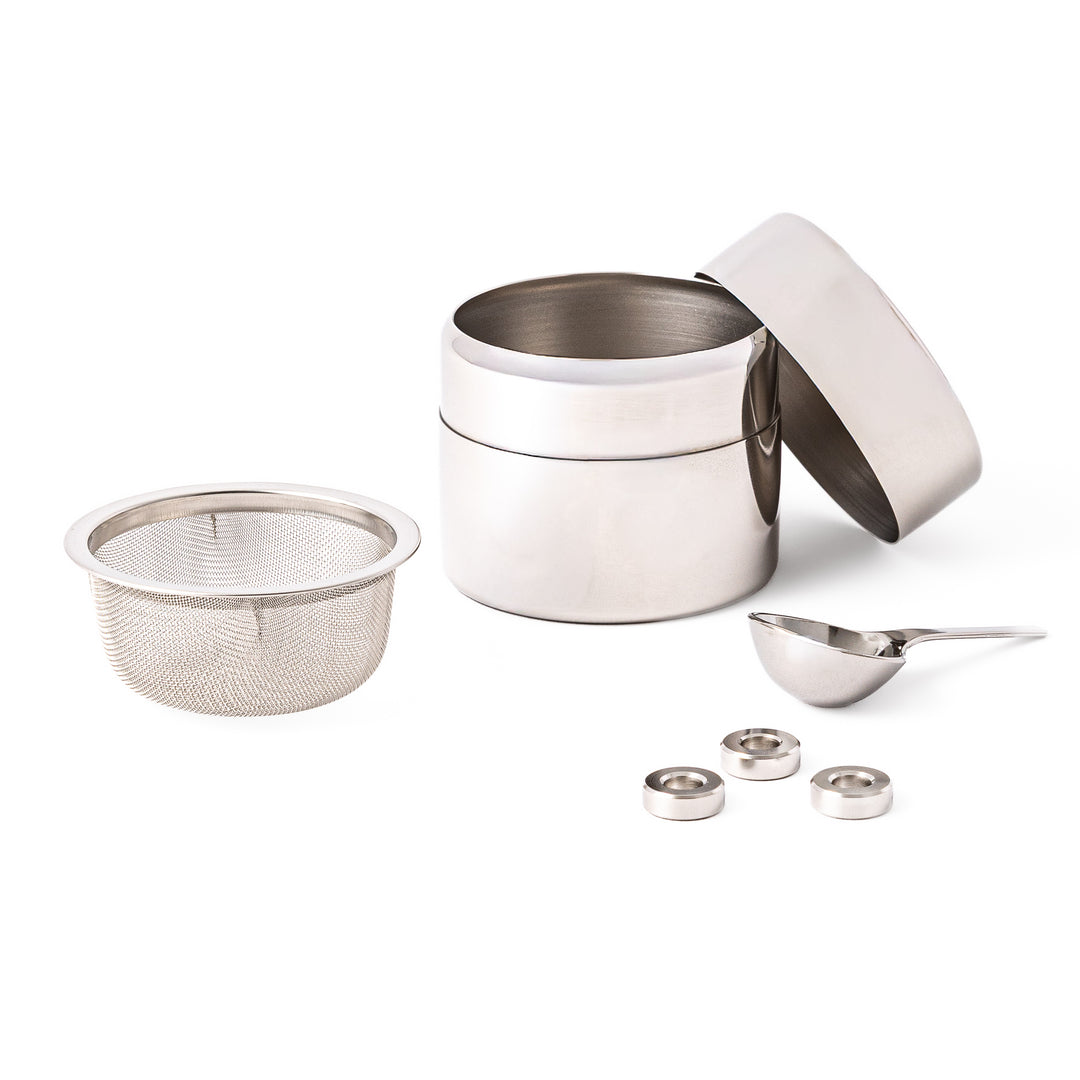 A Japanese stainless steel matcha sifter canister set with a fine mesh strainer scoop and sifting rings for smooth matcha powder