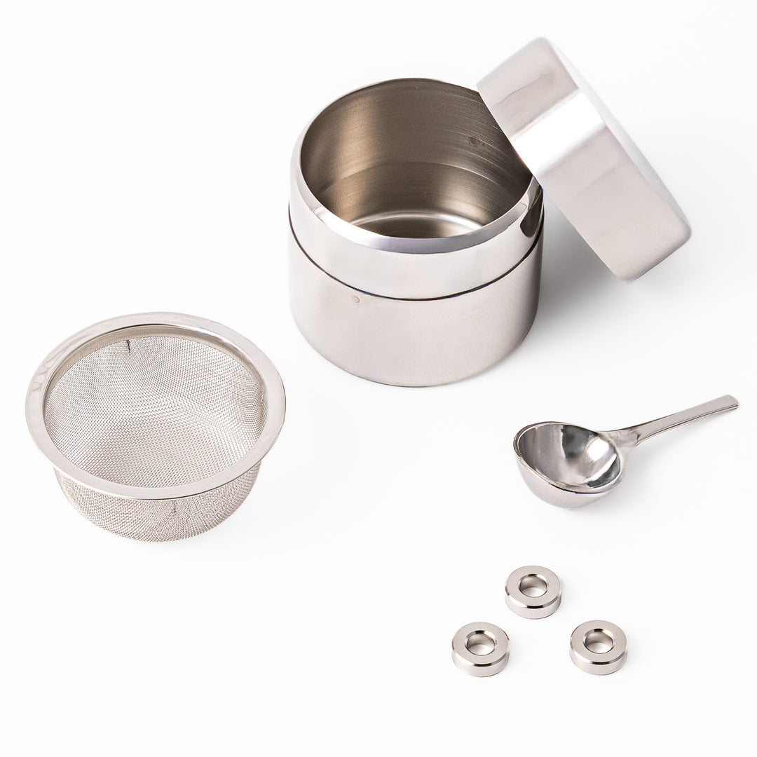 A Japanese stainless steel matcha sifter canister set with a fine mesh strainer scoop and sifting rings for smooth matcha powder