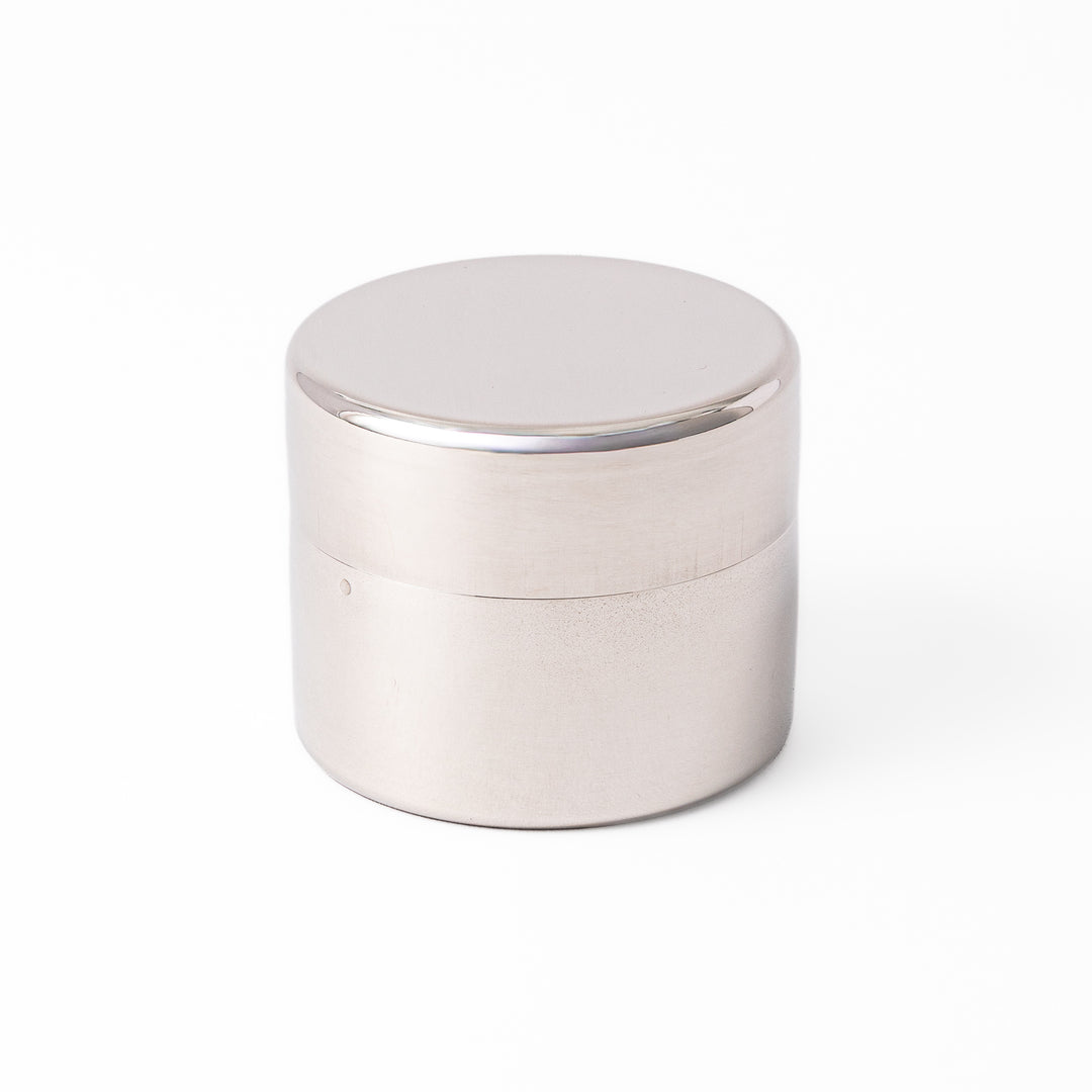 A Japanese stainless steel matcha sifter canister set with a fine mesh strainer scoop and sifting rings for smooth matcha powder