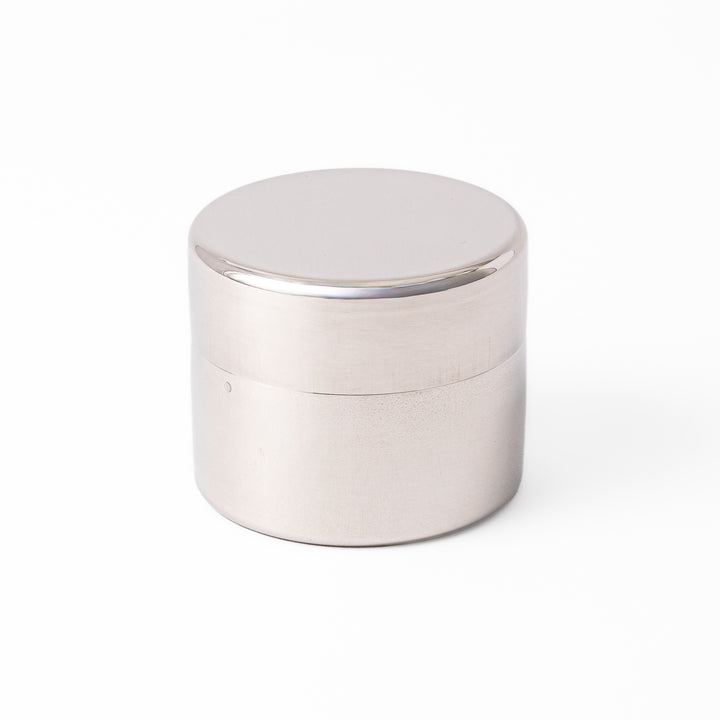 A Japanese stainless steel matcha sifter canister set with a fine mesh strainer scoop and sifting rings for smooth matcha powder