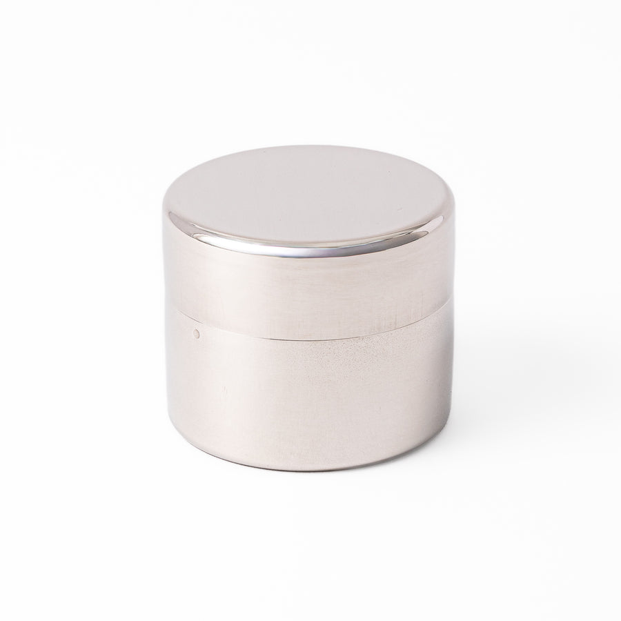 A Japanese stainless steel matcha sifter canister set with a fine mesh strainer scoop and sifting rings for smooth matcha powder