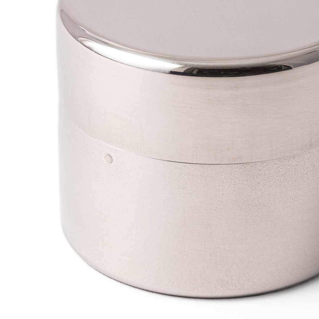 A Japanese stainless steel matcha sifter canister set with a fine mesh strainer scoop and sifting rings for smooth matcha powder