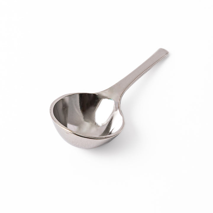 A Japanese stainless steel matcha sifter canister set with a fine mesh strainer scoop and sifting rings for smooth matcha powder