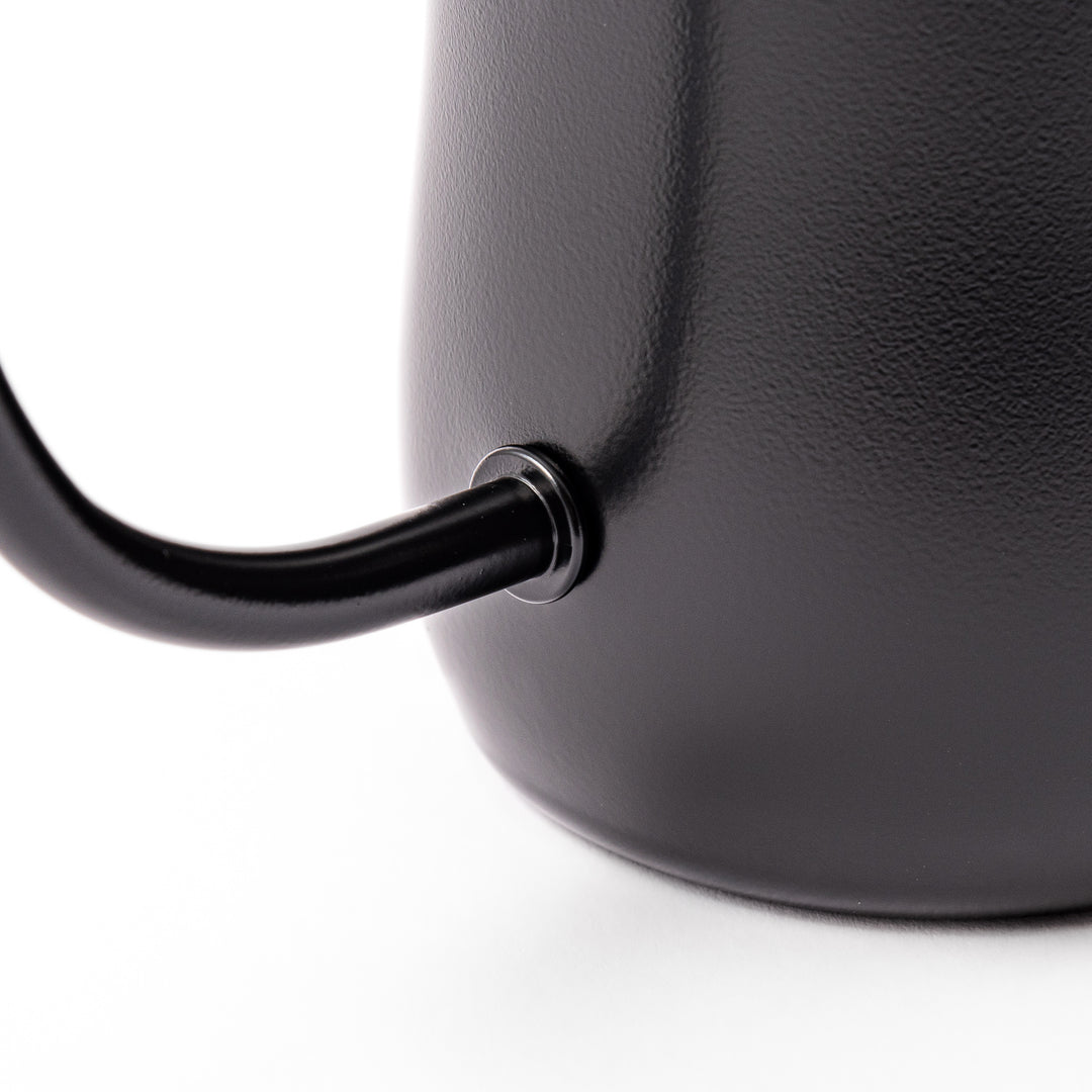 Japanese matte black precision pour kettle with a slender gooseneck spout and ergonomic handle, designed for controlled water flow in pour-over coffee brewing.