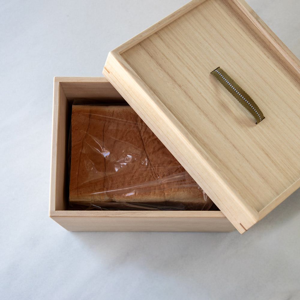Japanese Paulownia Wood Bread Storage Box 1.5 Loaf size featuring Sanada cord handle and bread inside   