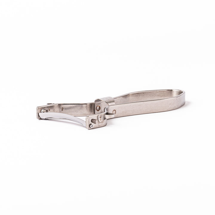 Japanese stainless steel ergonomic peeler with a sharp swivel blade and contoured handle designed for effortless peeling of vegetables and fruits in daily cooking.