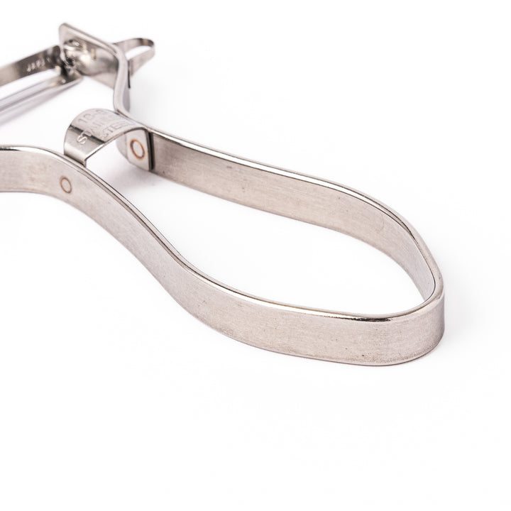 Japanese stainless steel ergonomic peeler with a sharp swivel blade and contoured handle designed for effortless peeling of vegetables and fruits in daily cooking.