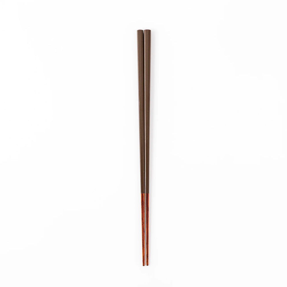 Pair of chestnut brown Japanese traditional color bamboo chopsticks with slim tips for refined and accurate dining