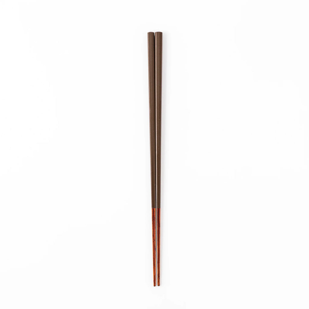 Pair of chestnut brown Japanese traditional color bamboo chopsticks with slim tips for refined and accurate dining