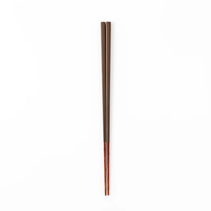 Pair of chestnut brown Japanese traditional color bamboo chopsticks with slim tips for refined and accurate dining