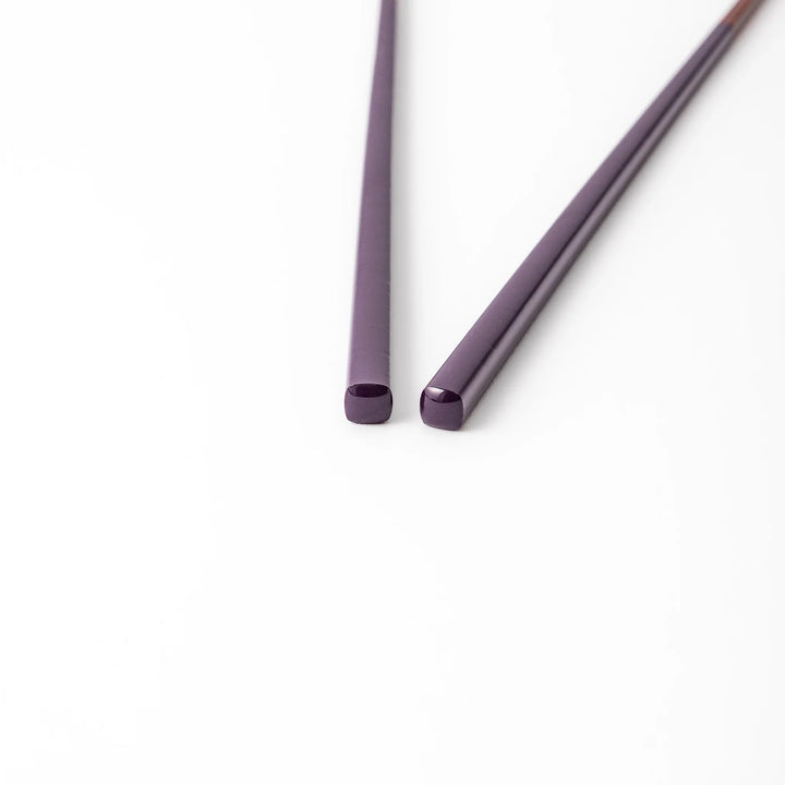 Pair of eggplant purple Japanese traditional color bamboo chopsticks with fine tips for an elegant and precise dining experience