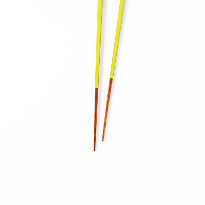 Pair of fresh leaf green Japanese traditional color bamboo chopsticks with fine tips for an elegant and precise dining experience
