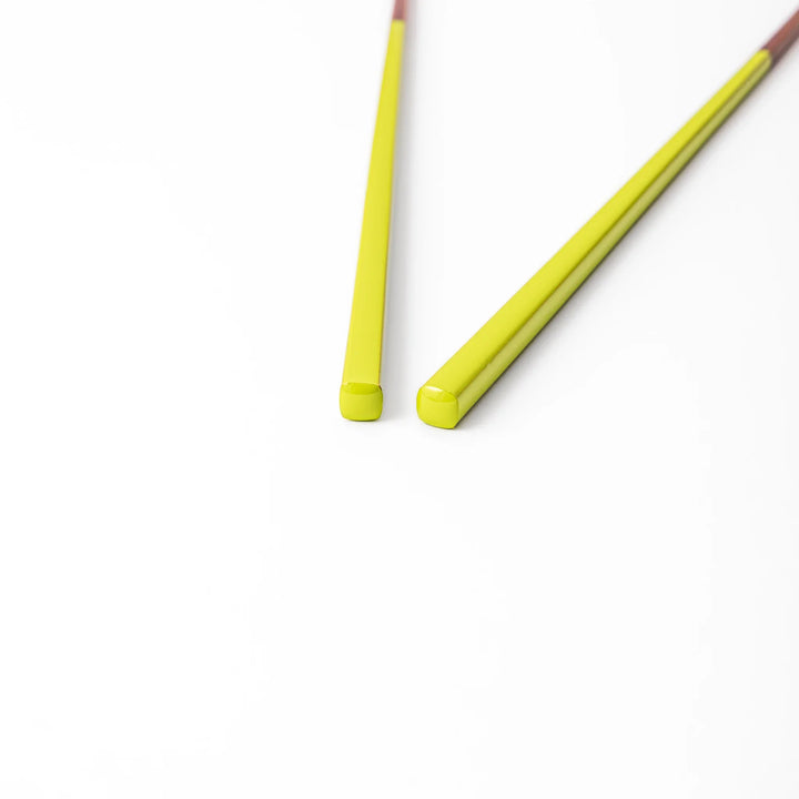 Pair of fresh leaf green Japanese traditional color bamboo chopsticks with fine tips for an elegant and precise dining experience