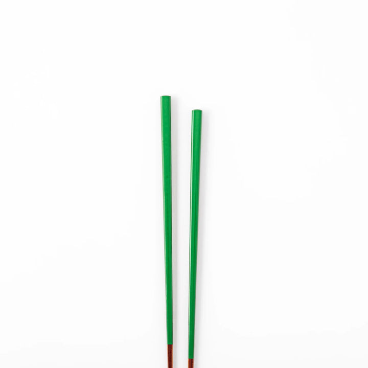Pair of evergreen green Japanese traditional color bamboo chopsticks with fine tips for an elegant and precise dining experience