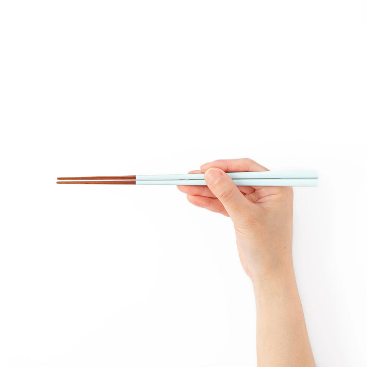 Pair of misty blue Japanese traditional color bamboo chopsticks with fine tips for an elegant and precise dining experience