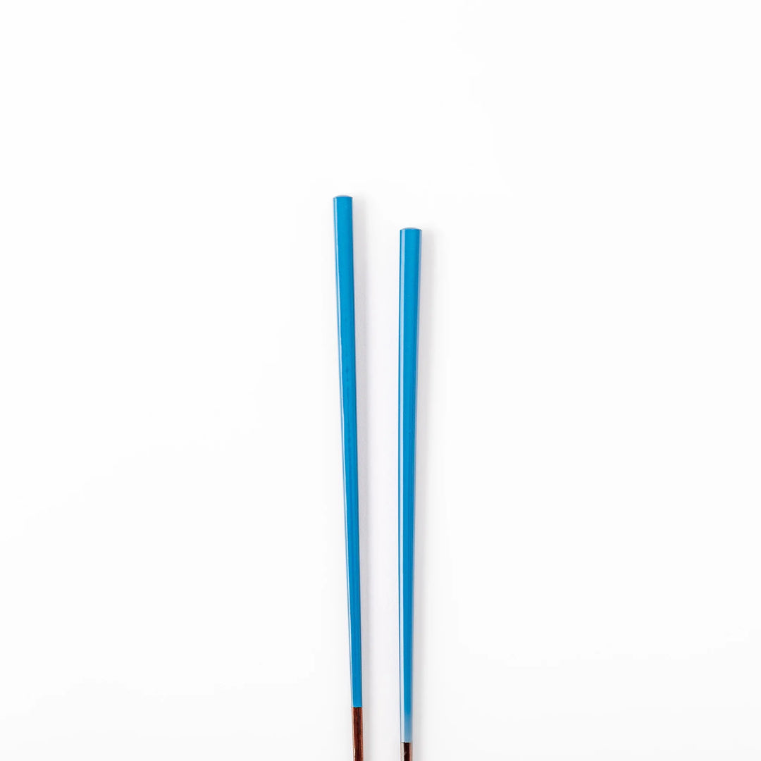 Pair of azure blue Japanese traditional color bamboo chopsticks with fine tips for an elegant and precise dining experience