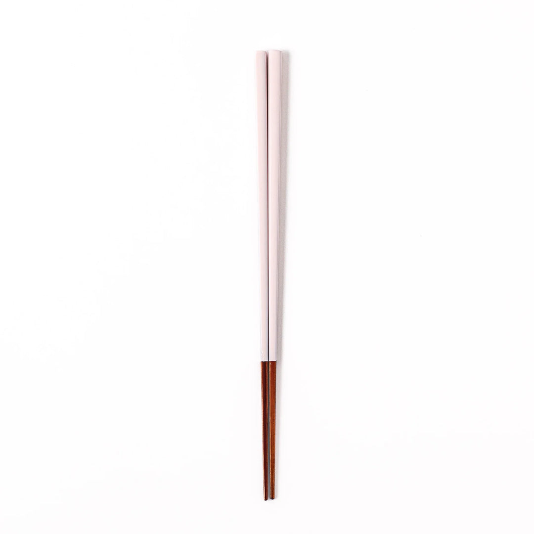 Pair of pale sakura pink Japanese traditional color bamboo chopsticks with fine tips for an elegant and precise dining experience