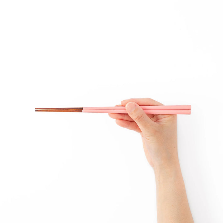 Pair of peach blossom pink Japanese traditional color bamboo chopsticks with fine tips for an elegant and precise dining experience