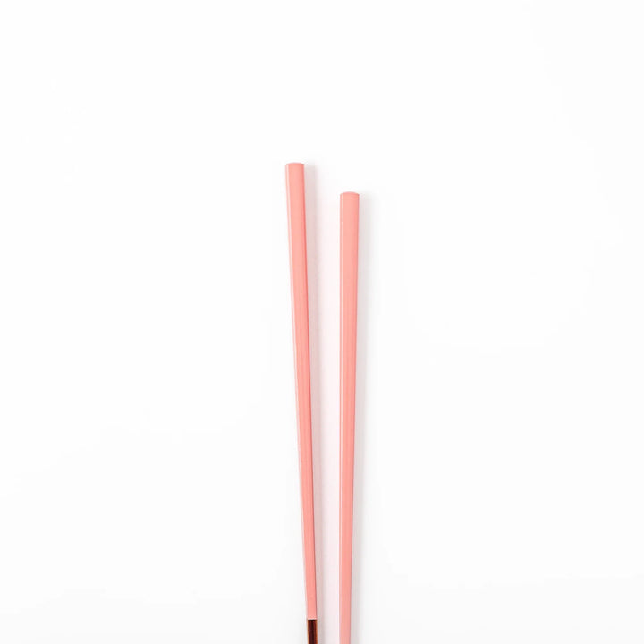 Pair of peach blossom pink Japanese traditional color bamboo chopsticks with fine tips for an elegant and precise dining experience