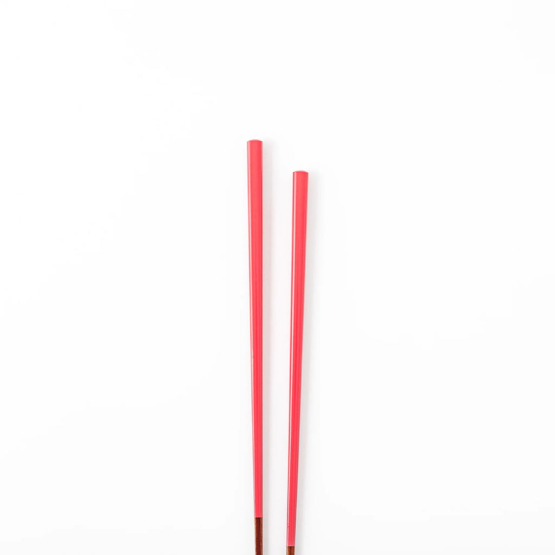 Pair of deep crimson Japanese traditional color bamboo chopsticks with fine tips for an elegant and precise dining experience