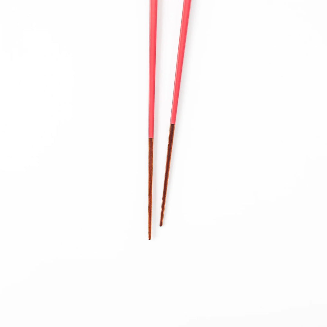 Pair of deep crimson Japanese traditional color bamboo chopsticks with fine tips for an elegant and precise dining experience