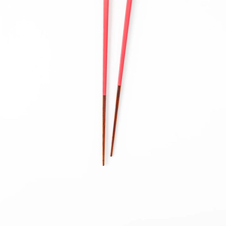 Pair of deep crimson Japanese traditional color bamboo chopsticks with fine tips for an elegant and precise dining experience