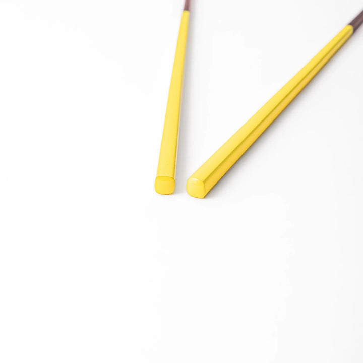 Pair of dandelion yellow Japanese traditional color bamboo chopsticks with fine tips for precise and elegant dining