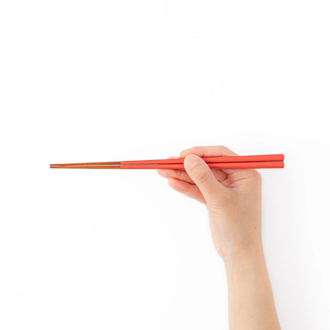 Pair of safflower red Japanese traditional color bamboo chopsticks with fine tips for an elegant and precise dining experience
