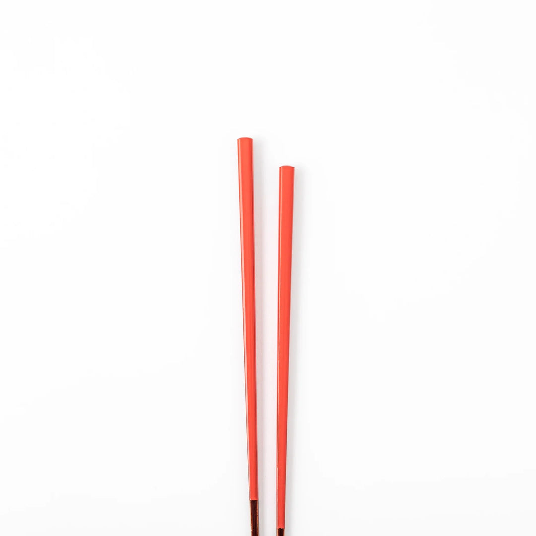 Pair of safflower red Japanese traditional color bamboo chopsticks with fine tips for an elegant and precise dining experience