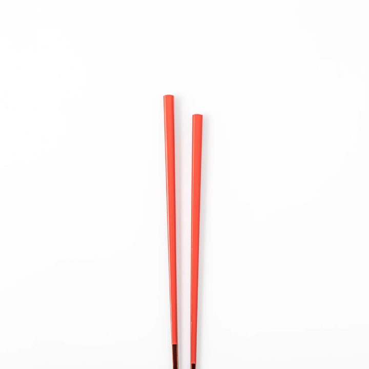Pair of safflower red Japanese traditional color bamboo chopsticks with fine tips for an elegant and precise dining experience