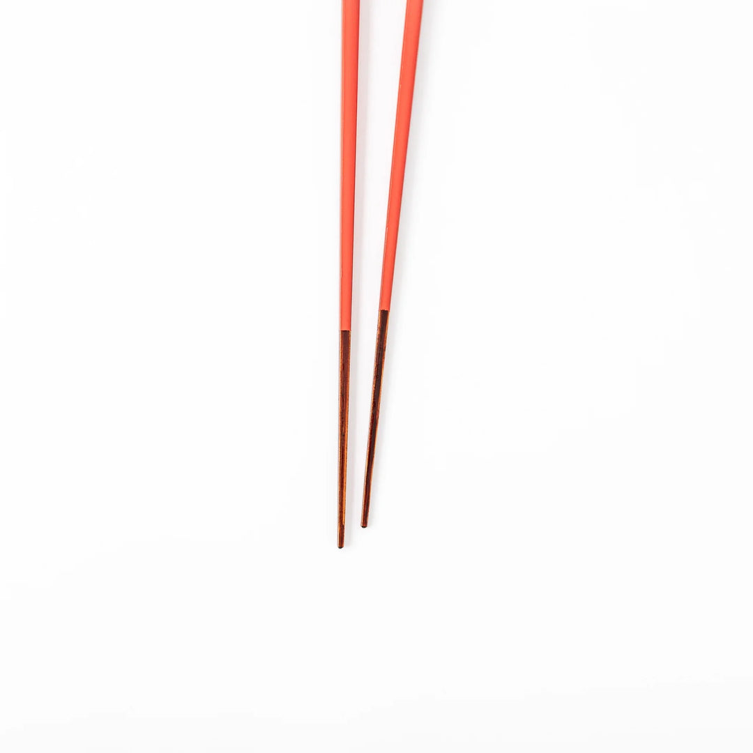Pair of safflower red Japanese traditional color bamboo chopsticks with fine tips for an elegant and precise dining experience