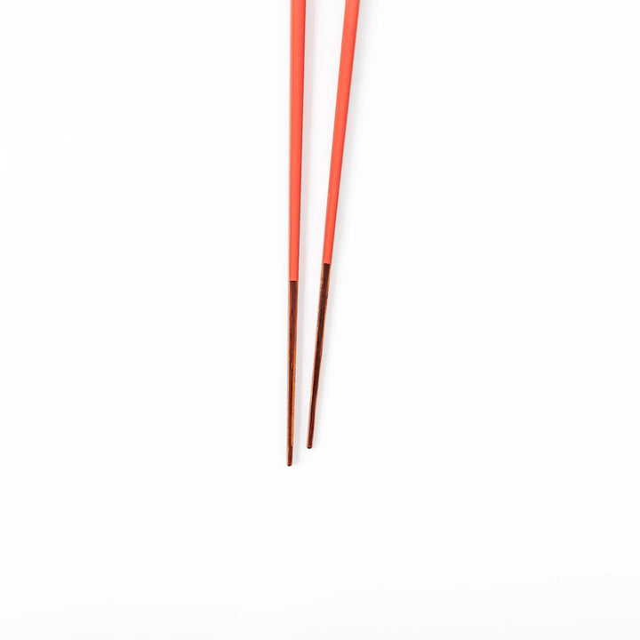 Pair of safflower red Japanese traditional color bamboo chopsticks with fine tips for an elegant and precise dining experience