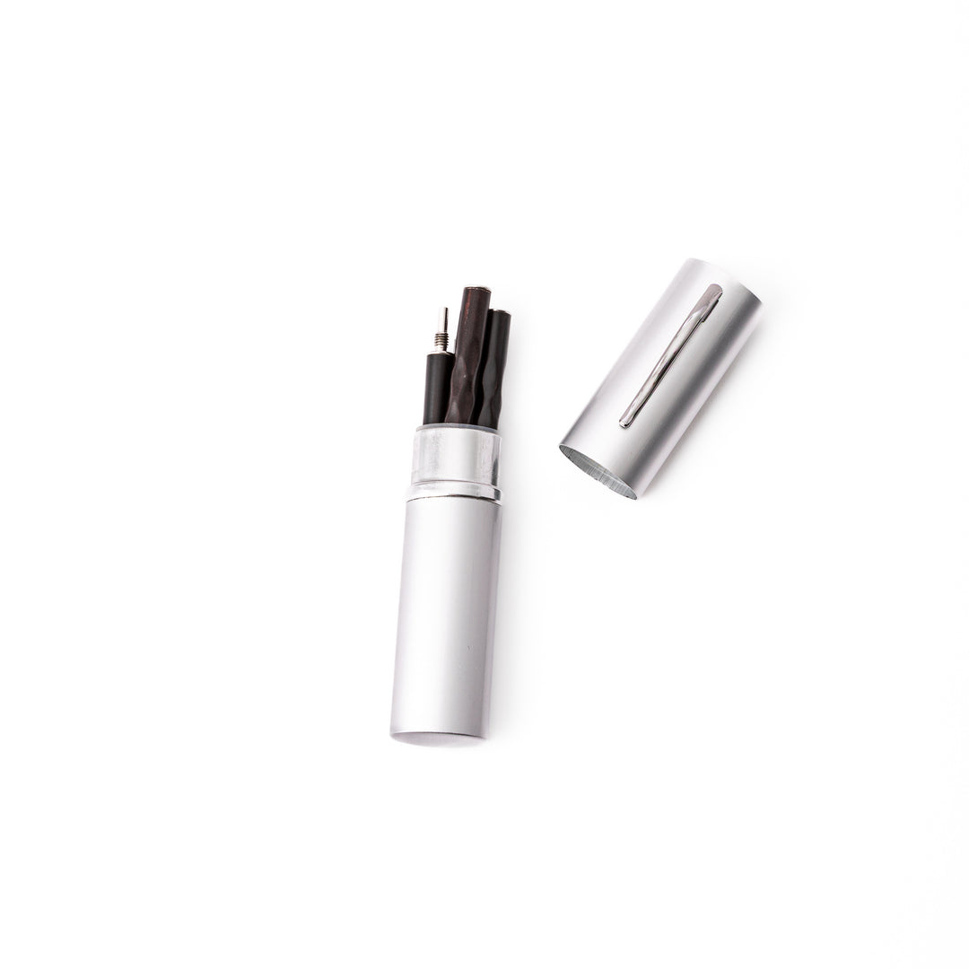 An open silver aluminum travel chopsticks case showing how the detached wooden chopsticks fit perfectly inside