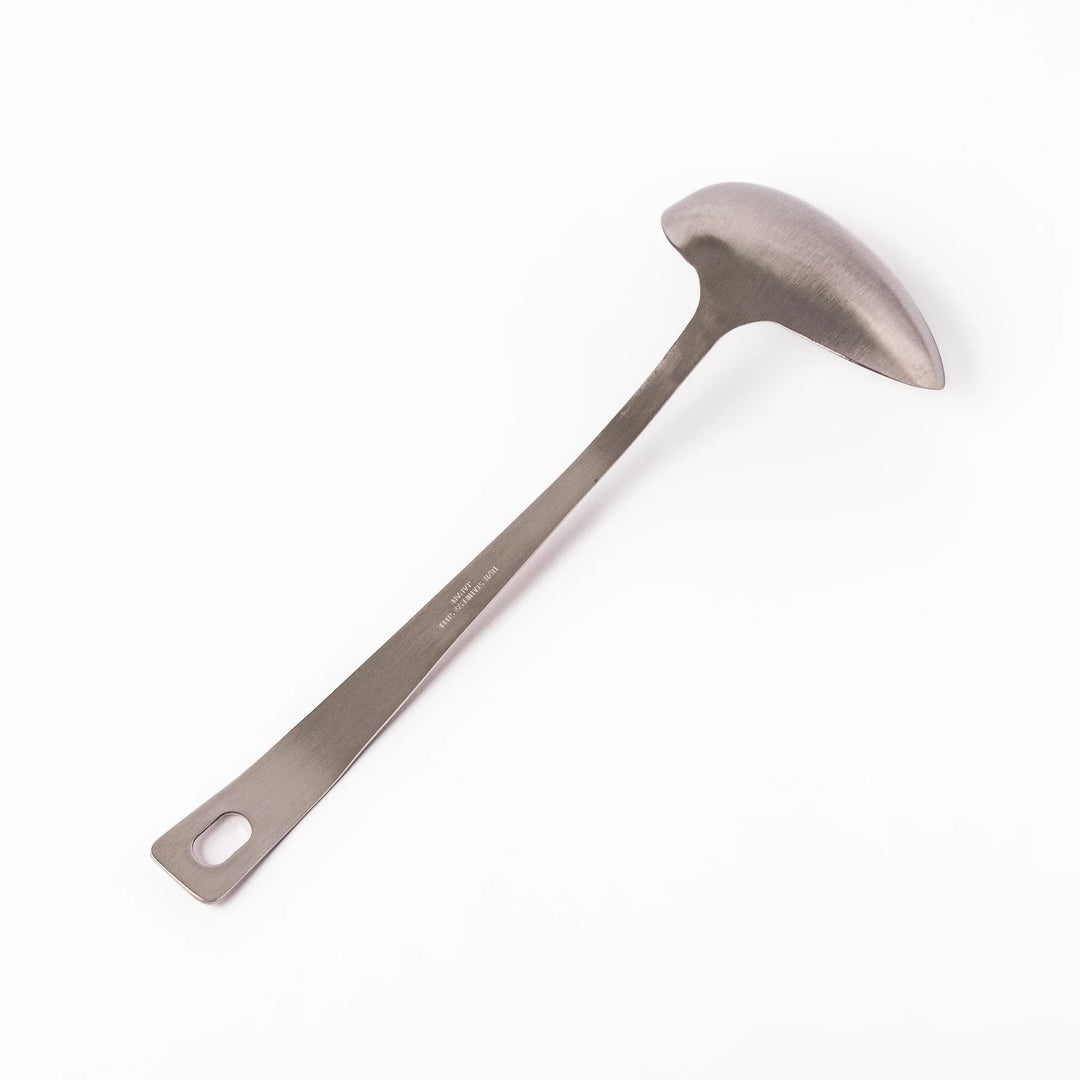 Japanese stainless steel soup ladle with long handle and deep curved bowl for serving soups and stews.