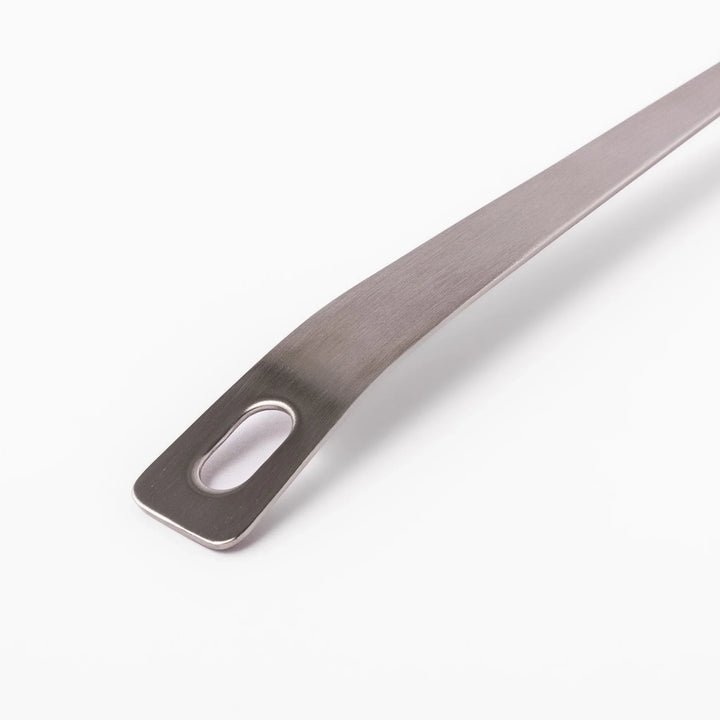 Japanese stainless steel soup ladle with long handle and deep curved bowl for serving soups and stews.