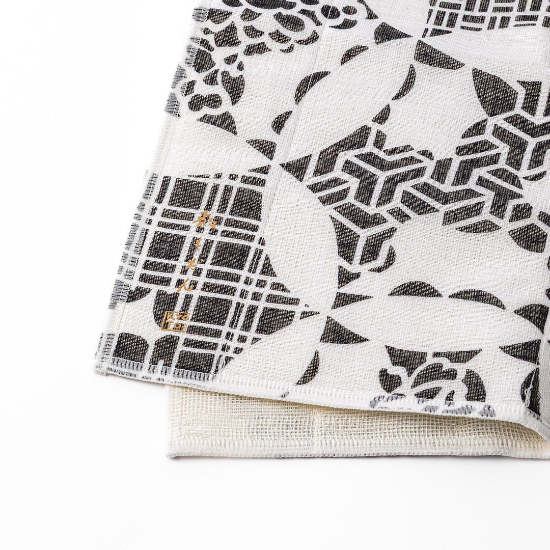 Kyoto Yuzen dyed Kaya cotton kitchen cloth featuring a monochrome Japanese Temari ball pattern with various traditional motifs