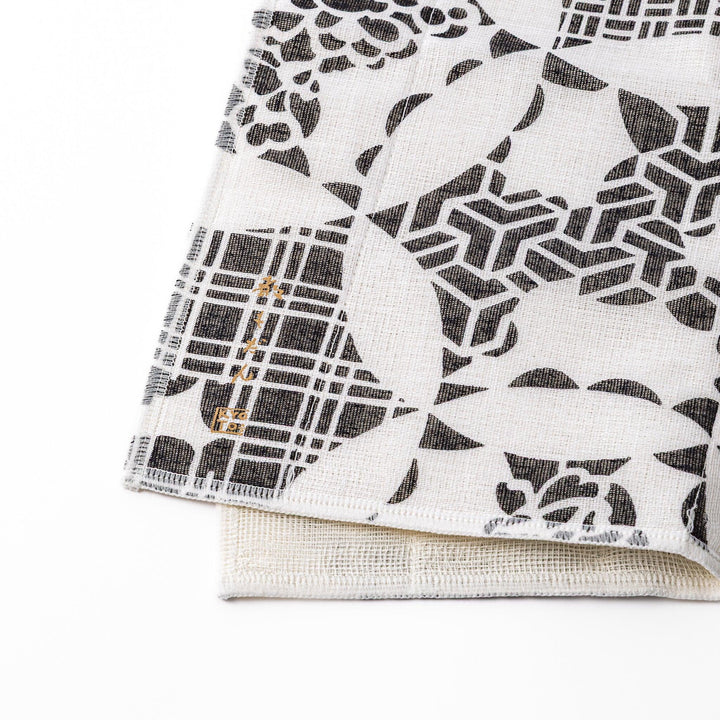Kyoto Yuzen dyed Kaya cotton kitchen cloth featuring a monochrome Japanese Temari ball pattern with various traditional motifs