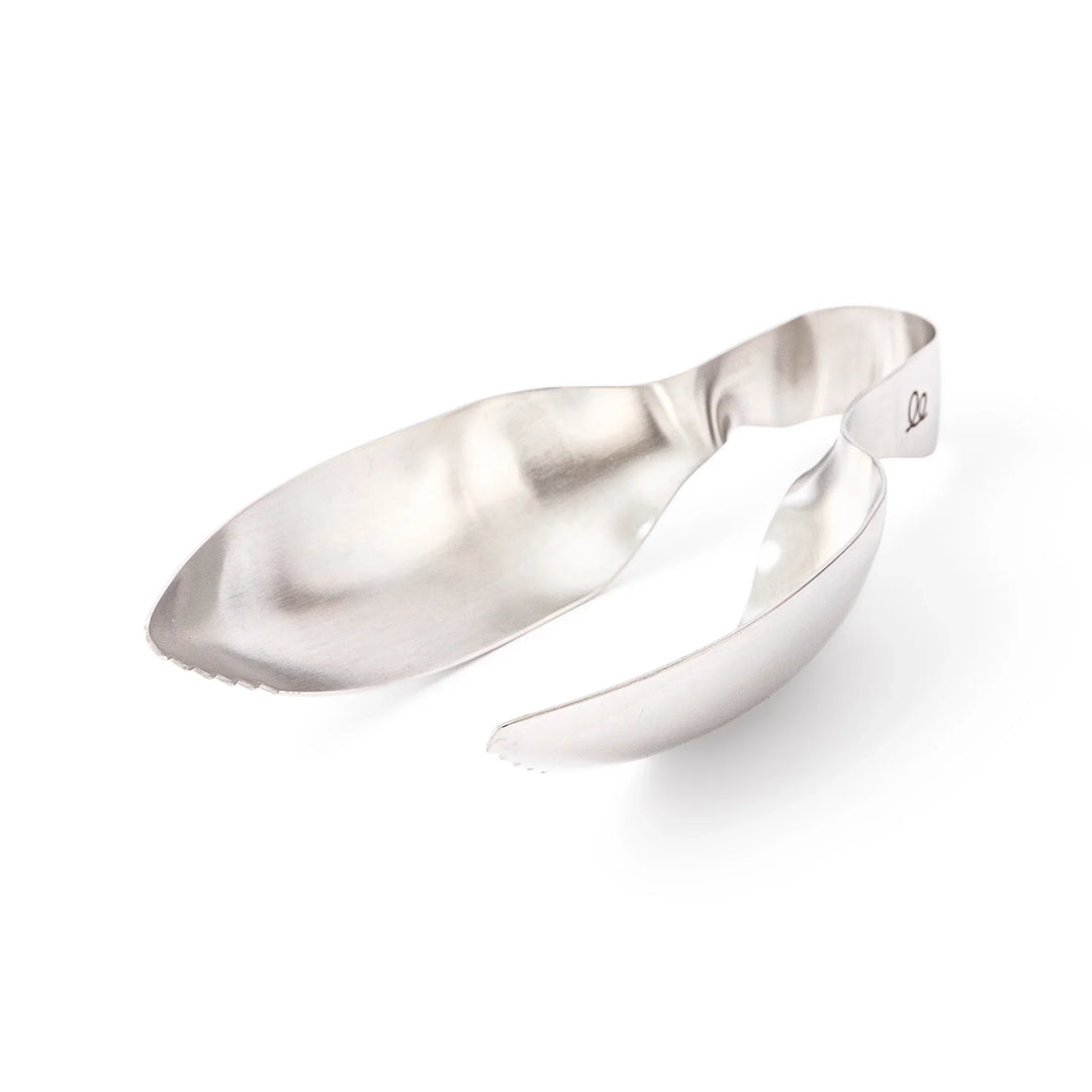 Japanese stainless steel ice scoop tongs with serrated edges and ergonomic curved design for secure grip and easy handling