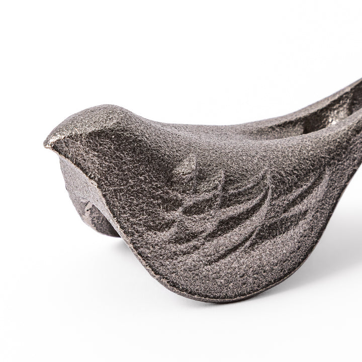 Little Bird Japanese Cast Iron Fish for boiling water to add iron supplement displayed on a plain white background