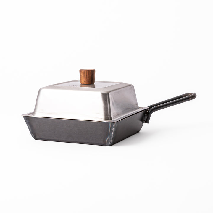 Square Japanese Luxe Carbon Steel Deep Pan with stainless steel lid displayed on a plain white background