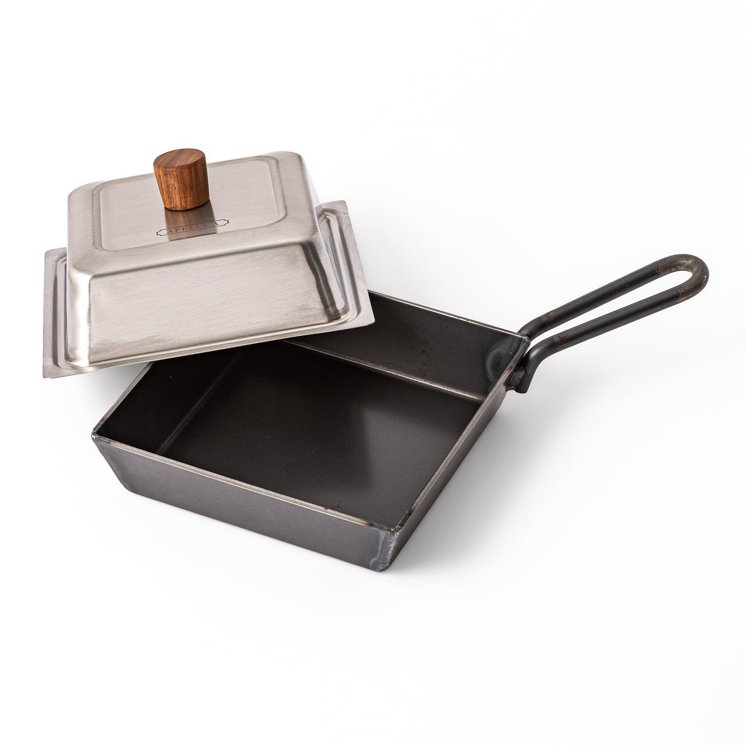 Square Japanese Luxe Carbon Steel Deep Pan with stainless steel lid displayed on a plain white background
