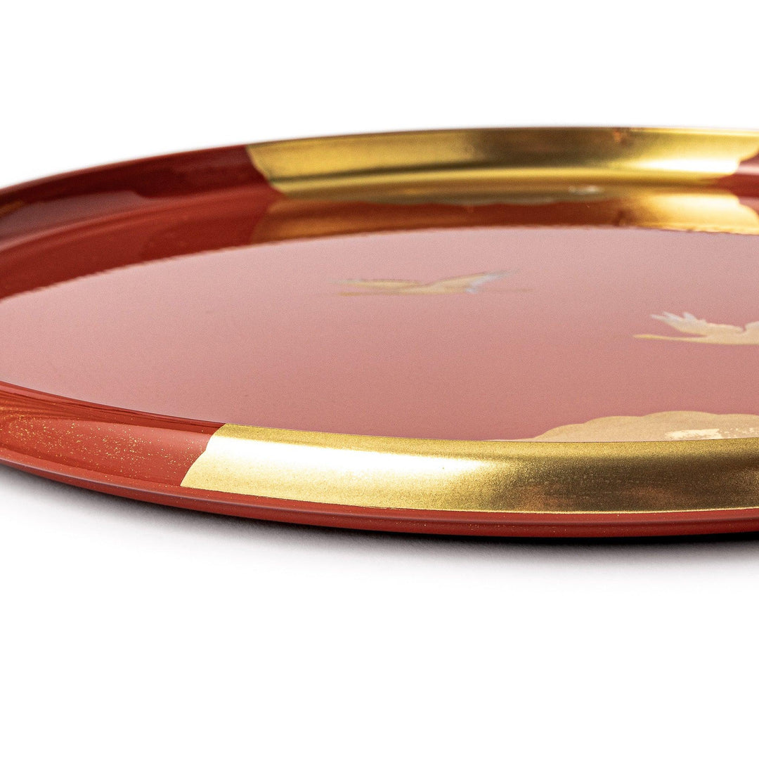Japanese lacquer serving tray with flying crane motif in gold on red finish elegant round design for traditional table setting