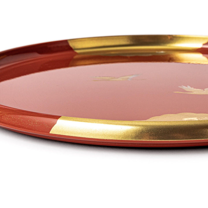Japanese lacquer serving tray with flying crane motif in gold on red finish elegant round design for traditional table setting