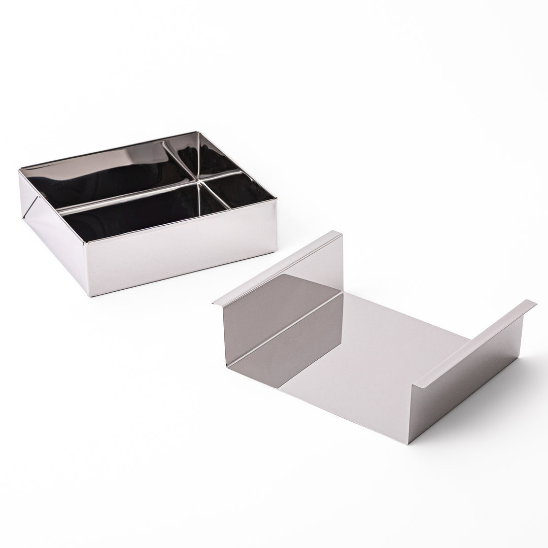 Japanese stainless steel Nagashikan jelly mold shown next to its separated removable inner tray on white background